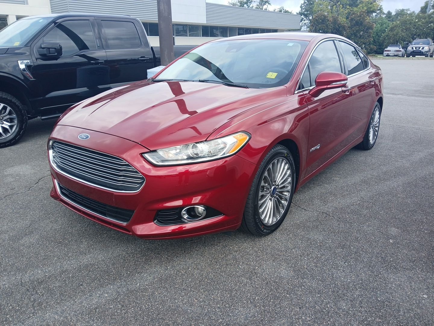 Used 2013 Ruby Red Metallic Ford Titanium image 1