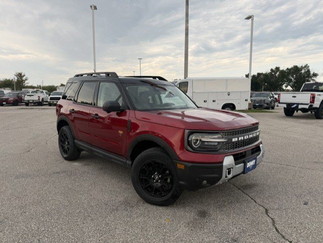 Used 2025 Ruby Red Metallic Ford Badlands image 1
