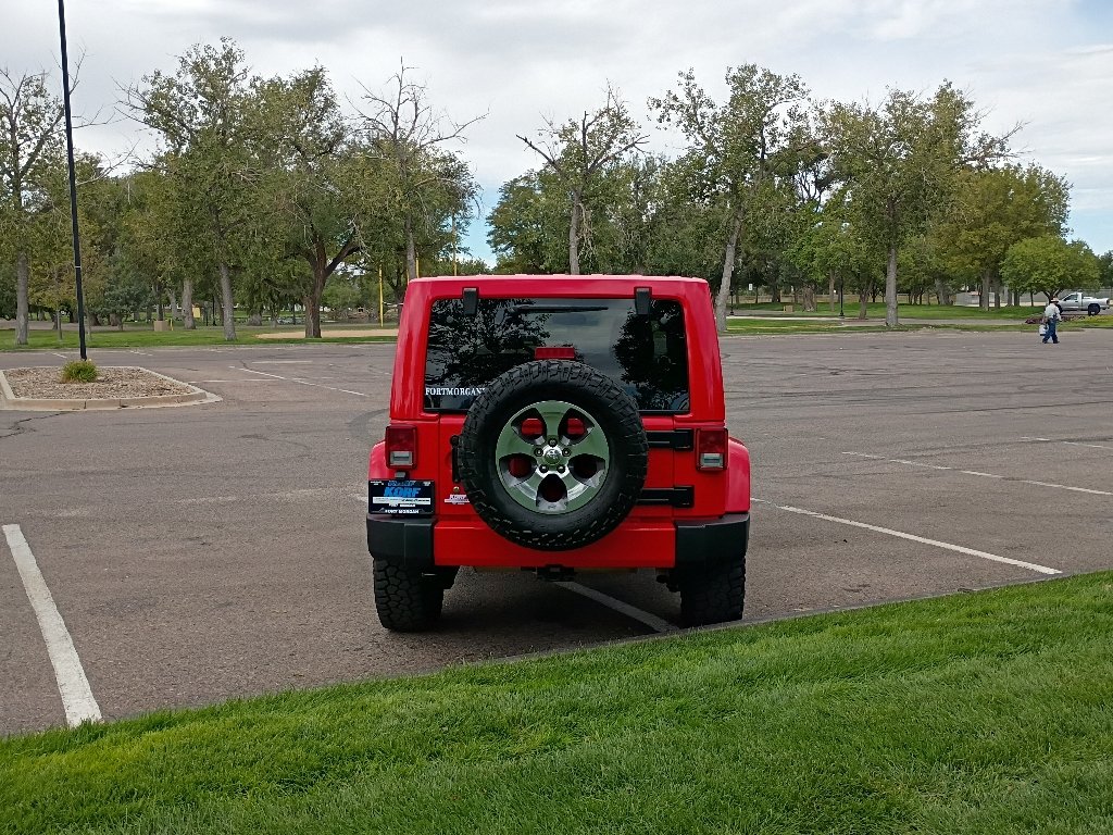 Used 2017 Firecracker Red Clearcoat Jeep Sahara image 4