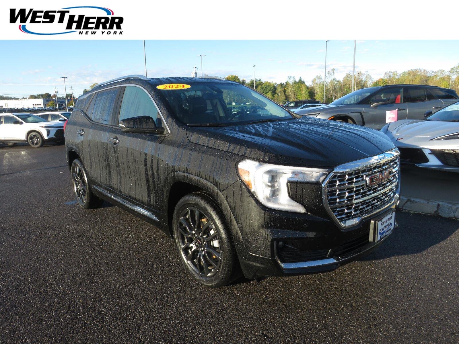 Used 2024 Ebony Twilight Metallic GMC Denali image 1