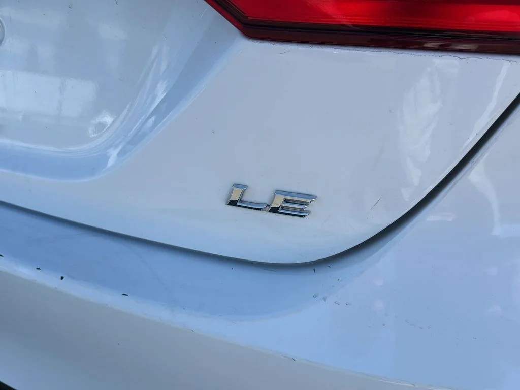 Used 2021 Super White Toyota LE image 34