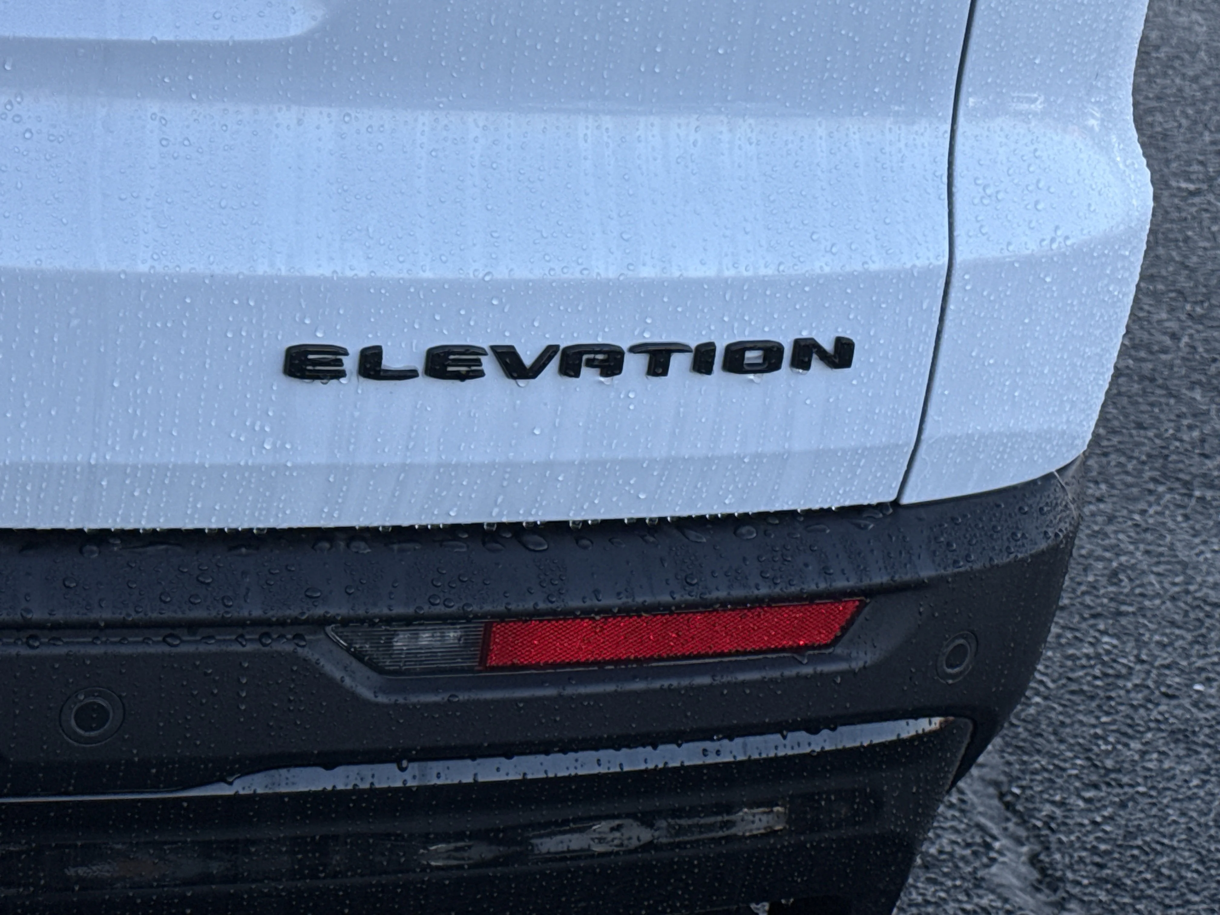 New 2026 Glacier White Tricoat GMC AWD Elevation image 12