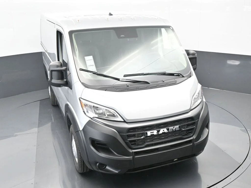 Used 2025 Bright Silver Clearcoat Metallic Ram Low Roof image 46