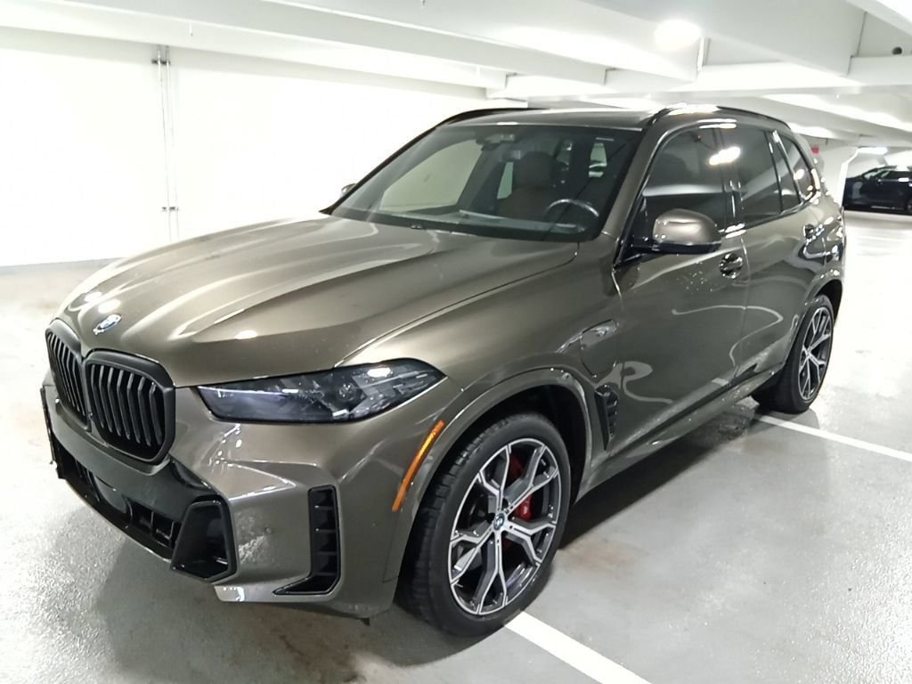 Used 2024 Manhattan Green Metallic BMW xDrive50e image 1