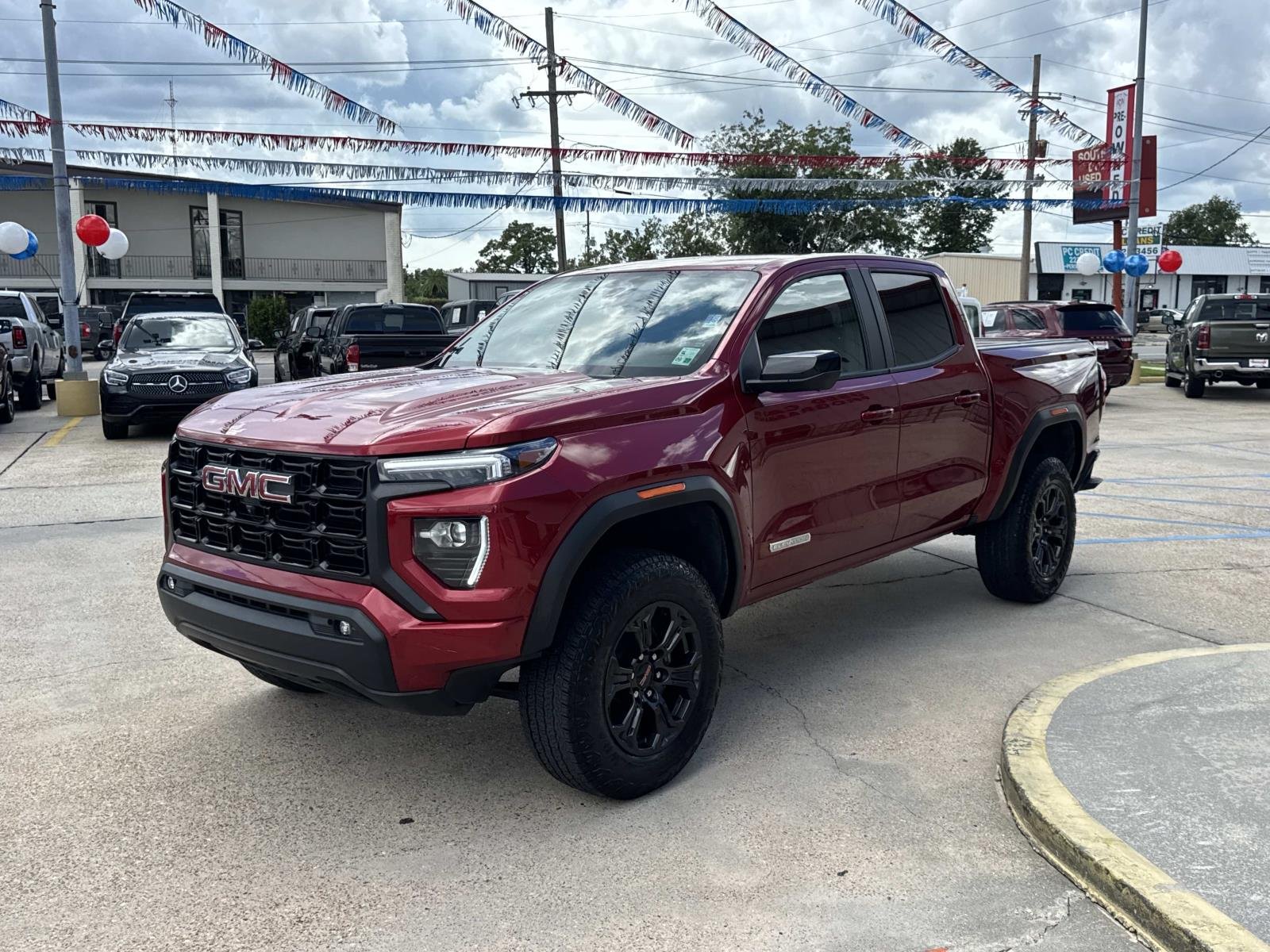 Used 2025 Volcanic Red Tintcoat GMC 2WD Elevation image 3