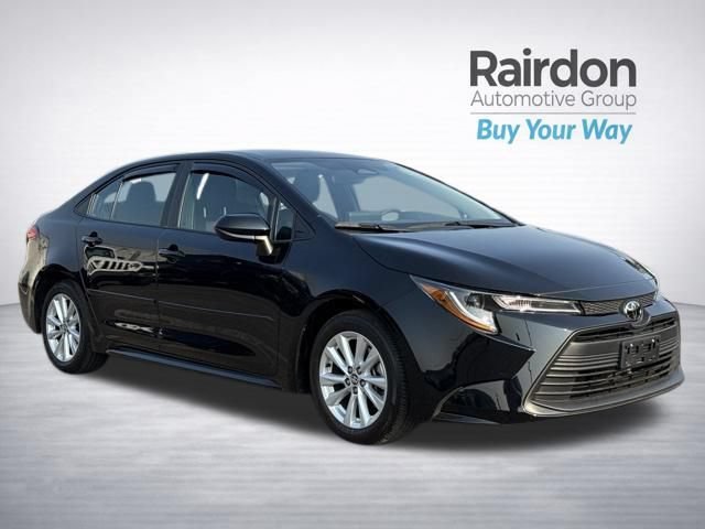 Used 2024 Midnight Black Metallic Toyota LE image 1