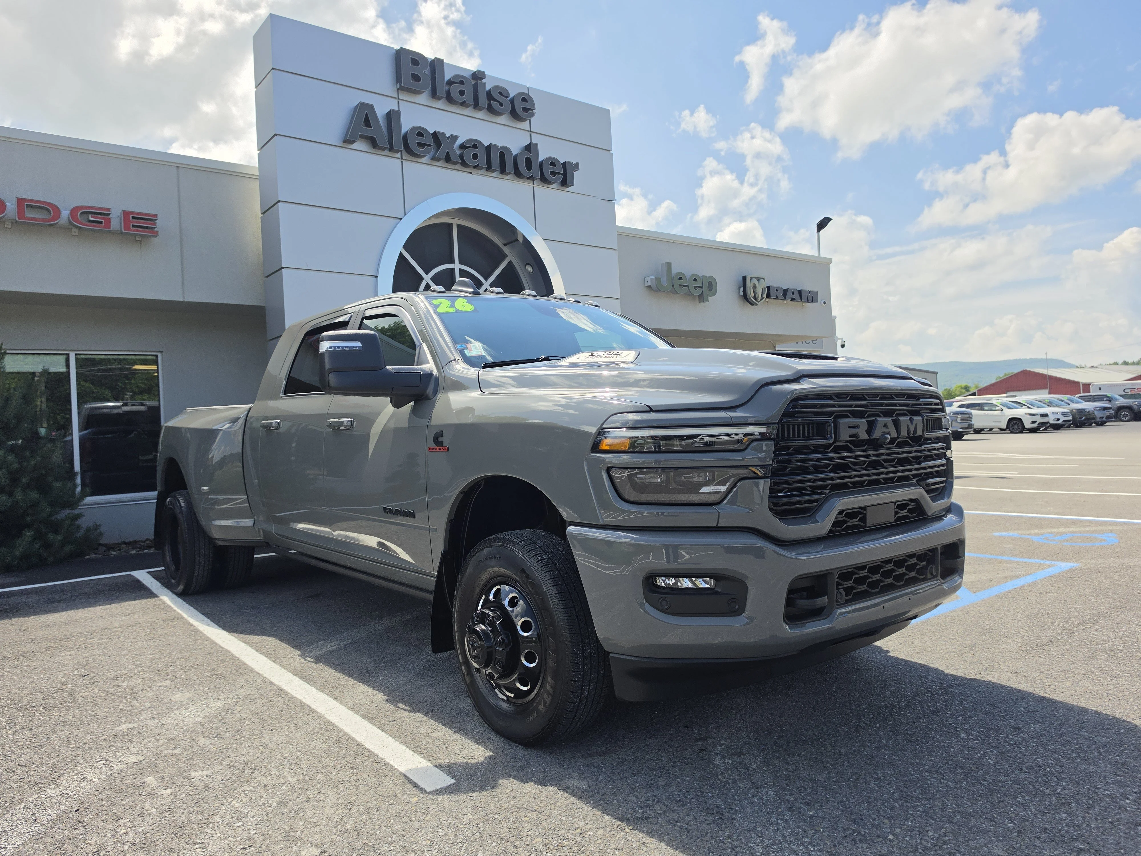 Used 2026 Ceramic Gray Clearcoat Ram Laramie image 1