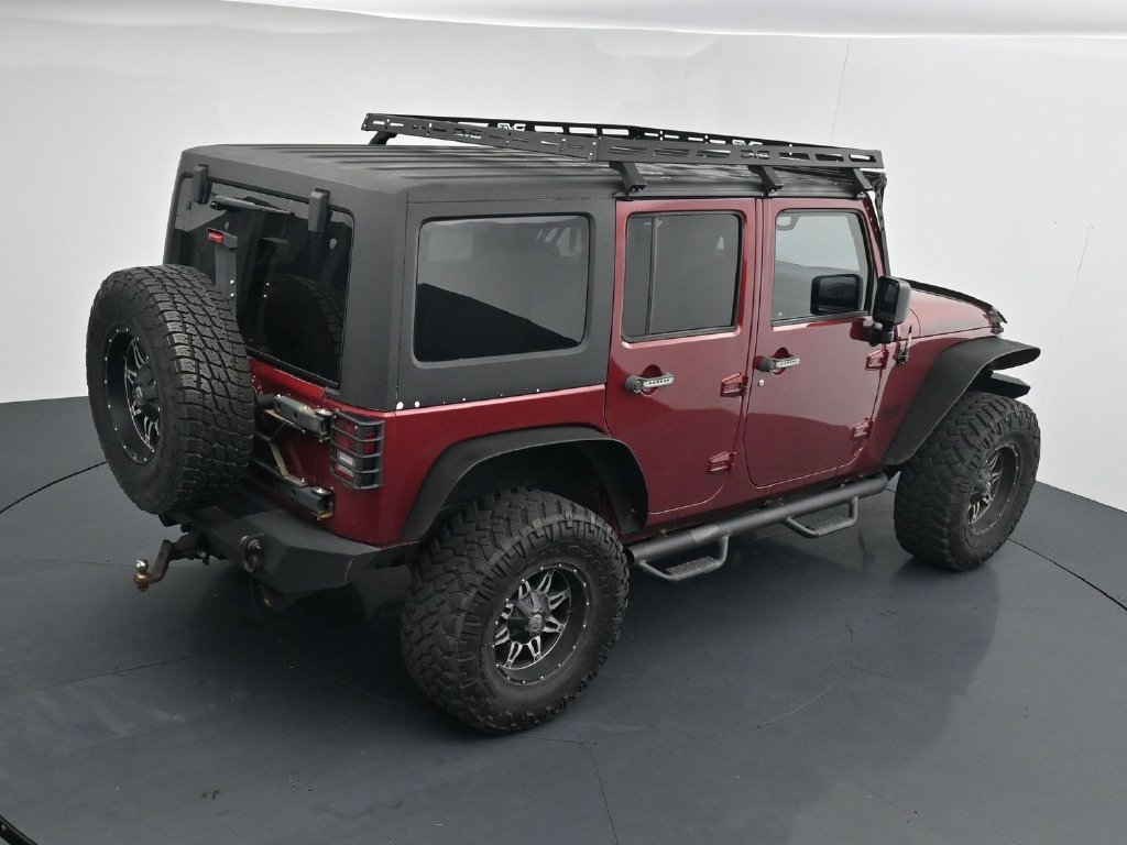 Used 2012 Red Jeep Unlimited Sport image 16