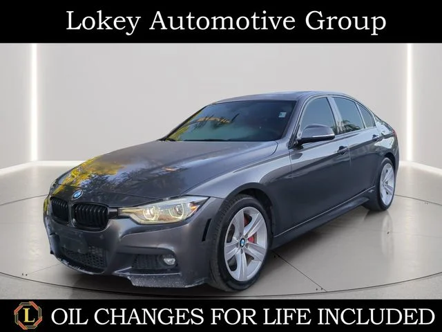 Used 2016 Gray BMW 328i xDrive image 1