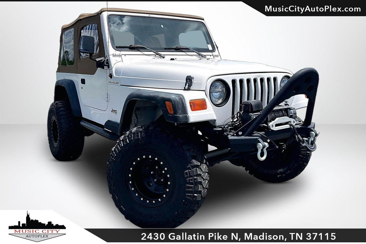 Used 1998 Stone White (cc) Jeep SE image 1
