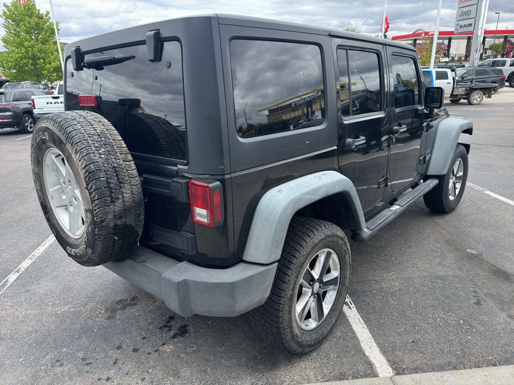 Used 2011 Black Clearcoat Jeep Sport image 5