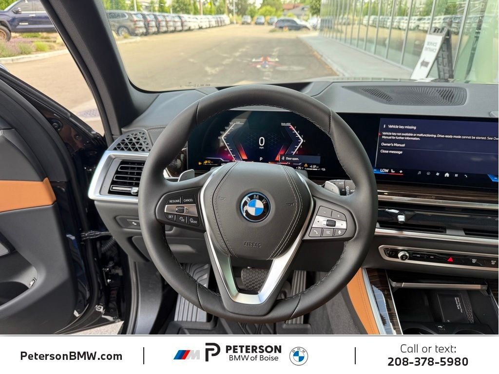 New 2026 Black Sapphire Metallic BMW xDrive50e image 20