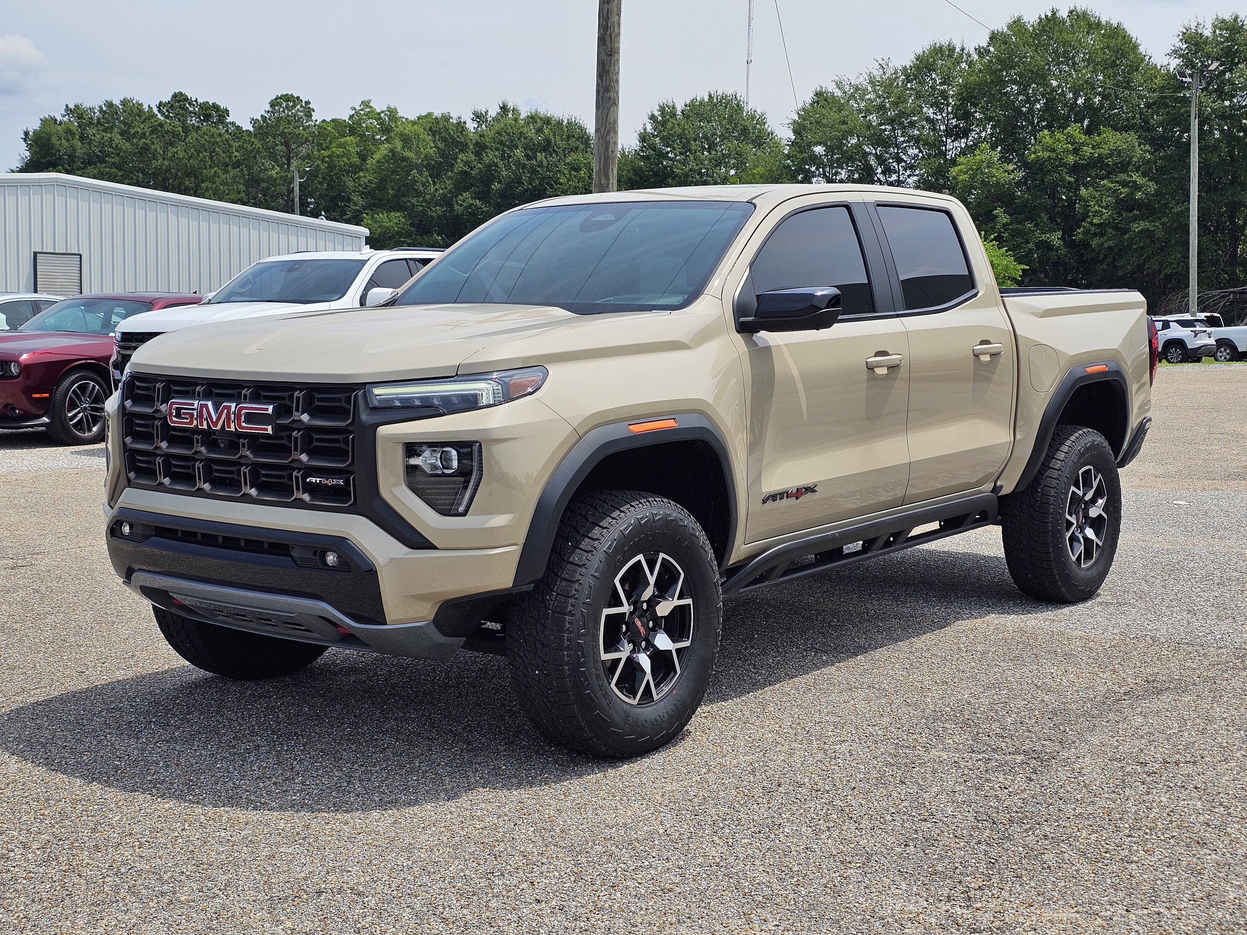 Used 2023 Desert Sand Metallic GMC 4WD AT4X image 1