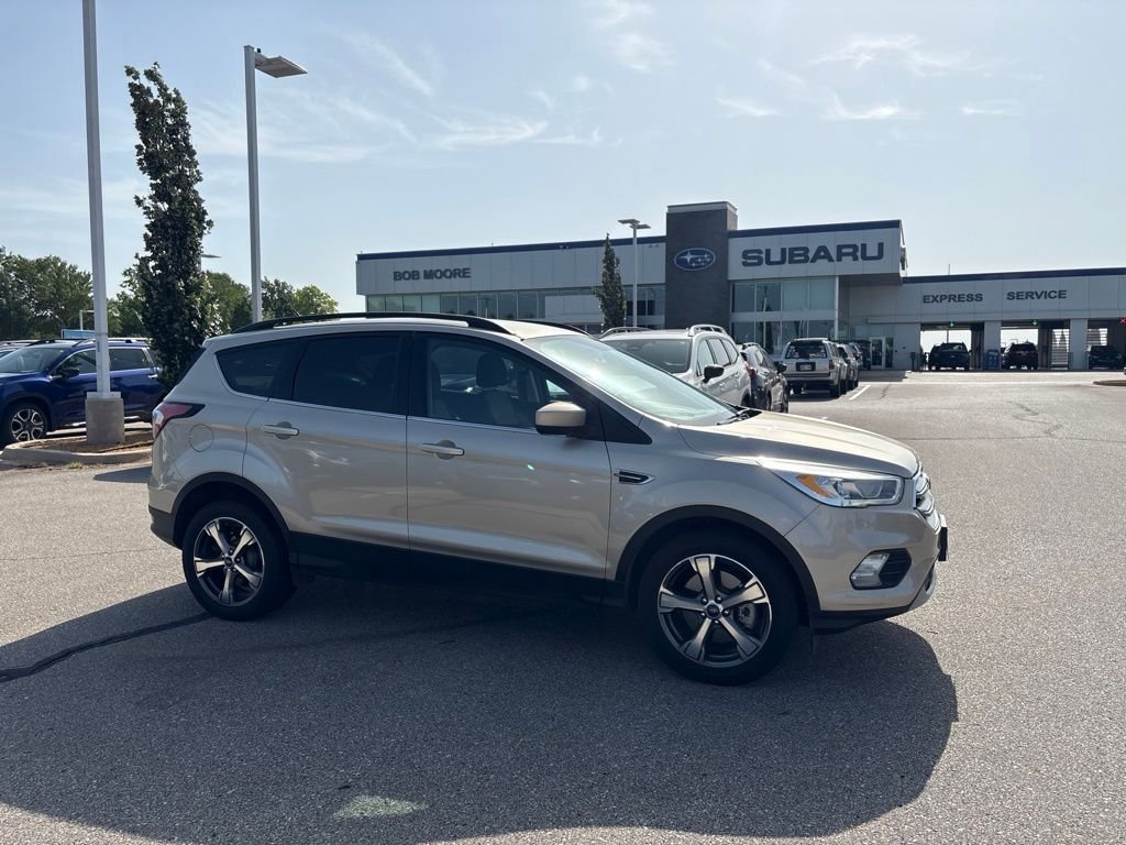 Used 2017 Gold Ford SE image 1
