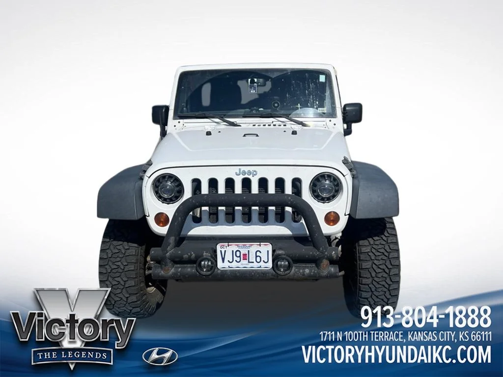 Used 2013 White Jeep Unlimited Sport image 2