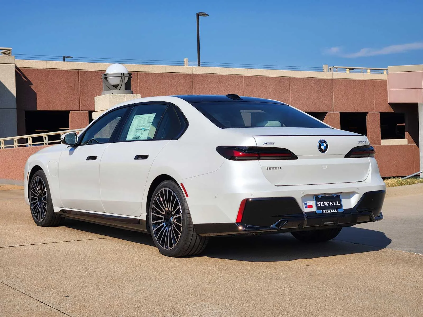 New 2026 Mineral White Metallic BMW 750e xDrive image 3