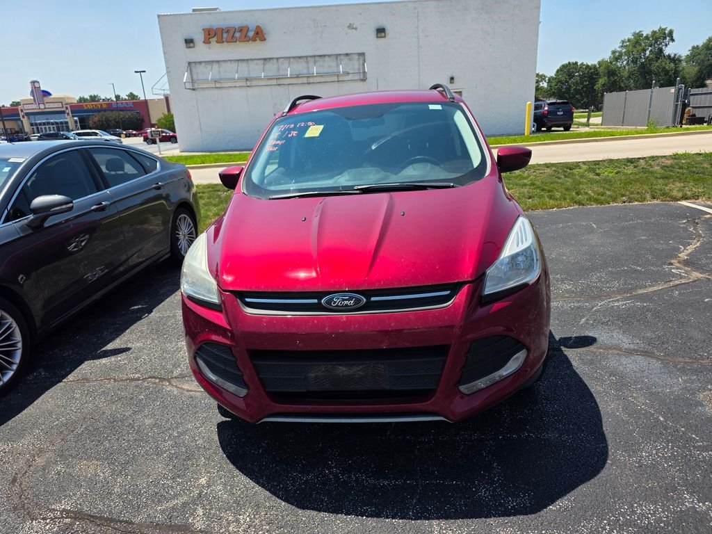 Used 2016 Ruby Red Metallic Ford SE image 1