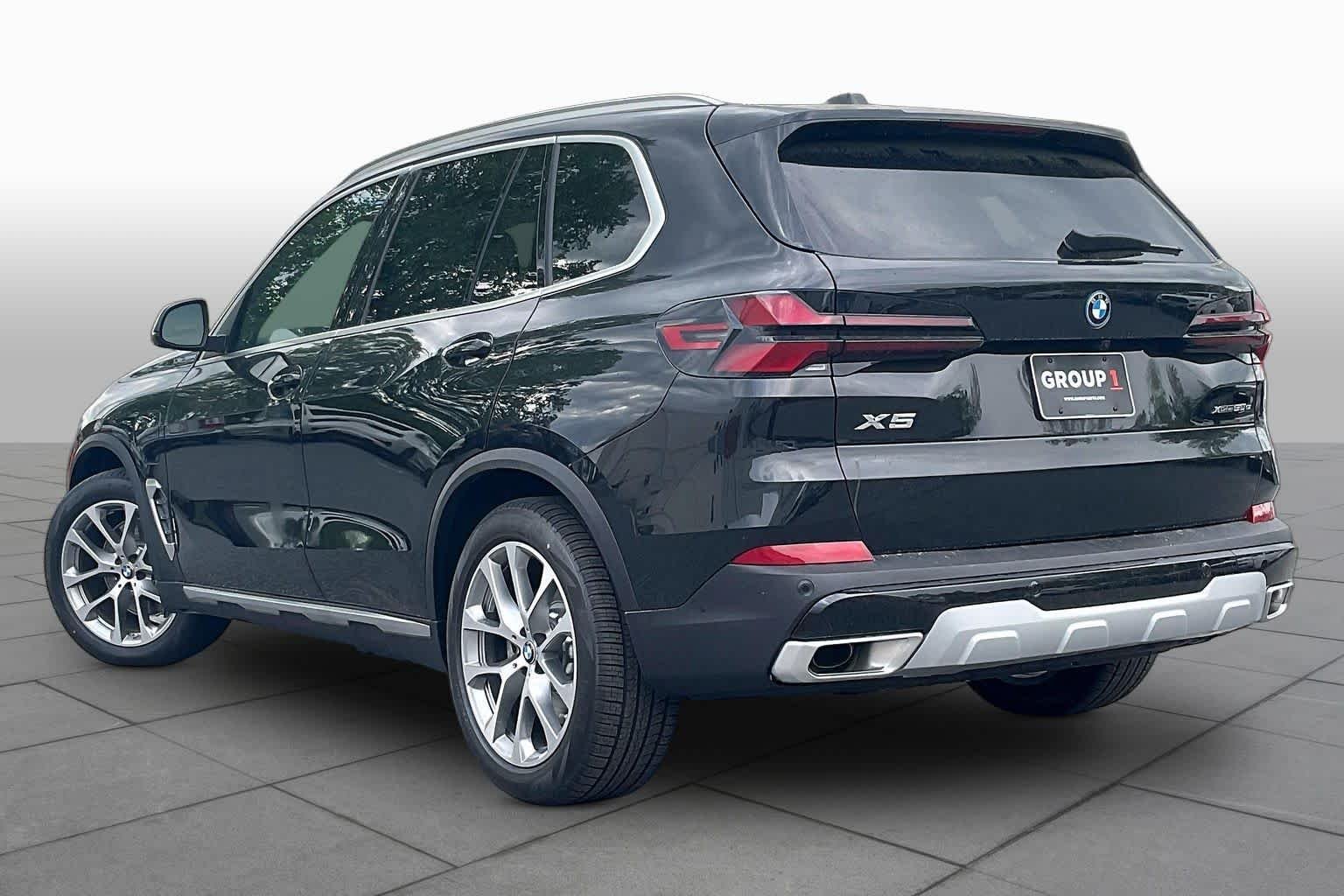 Used 2026 Black Sapphire Metallic BMW xDrive50e image 12