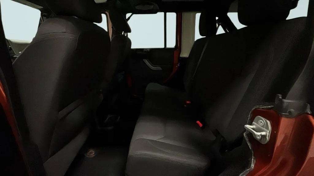 Used 2014 Orange Jeep Unlimited Sport image 13