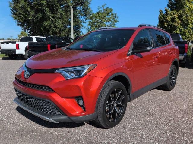 Certified Used 2016 Hot Lava Toyota SE image 2