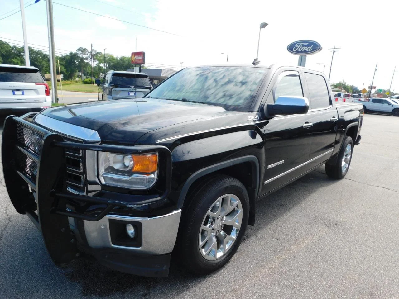 Used 2014 Black GMC 4WD Crew Cab 143.5 in SLT image 4