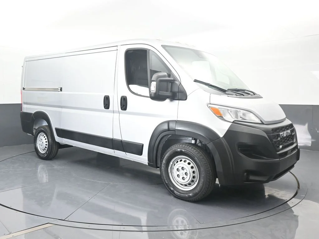 Used 2025 Bright Silver Clearcoat Metallic Ram Low Roof image 8