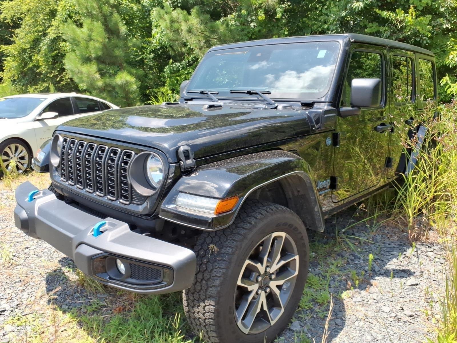 Used 2024 Black Clearcoat Jeep Sport S image 1