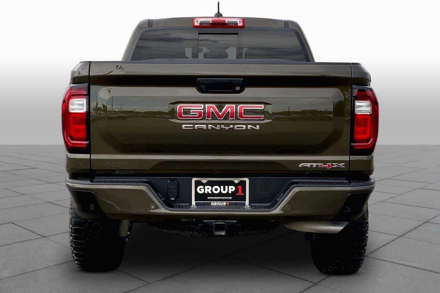 Used 2024 Deep Bronze Metallic GMC 4WD AT4X image 5