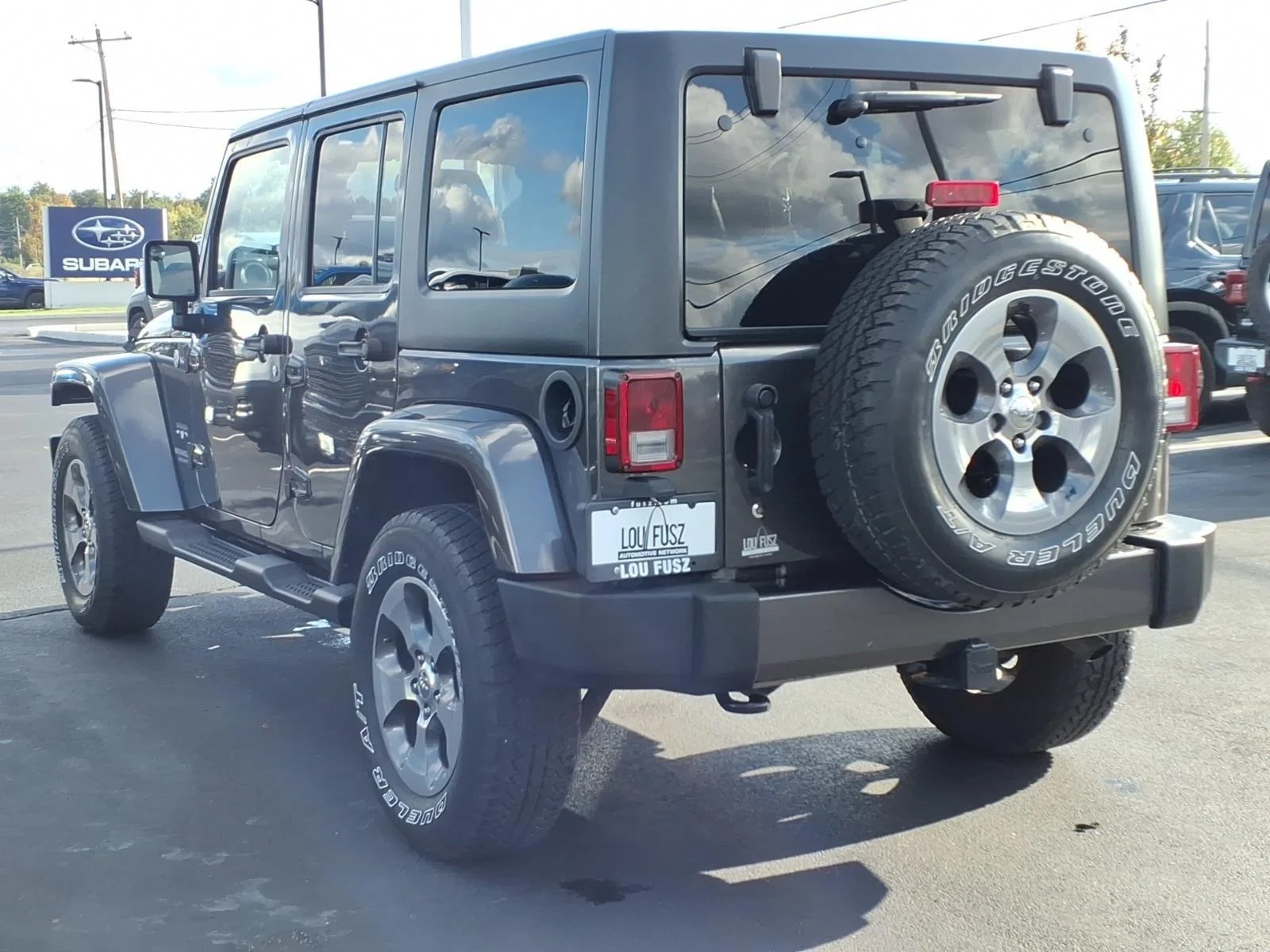 Used 2017 Granite Crystal Metallic Clearcoat Jeep Sahara image 5