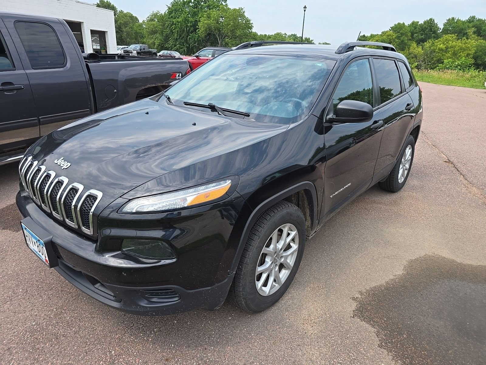 Used 2016 Brilliant Black Crystal Pearlcoat JEEP Sport image 1