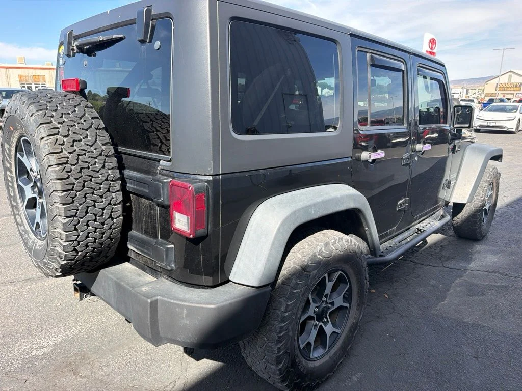 Used 2014 Black Clearcoat Jeep Unlimited Sport image 4
