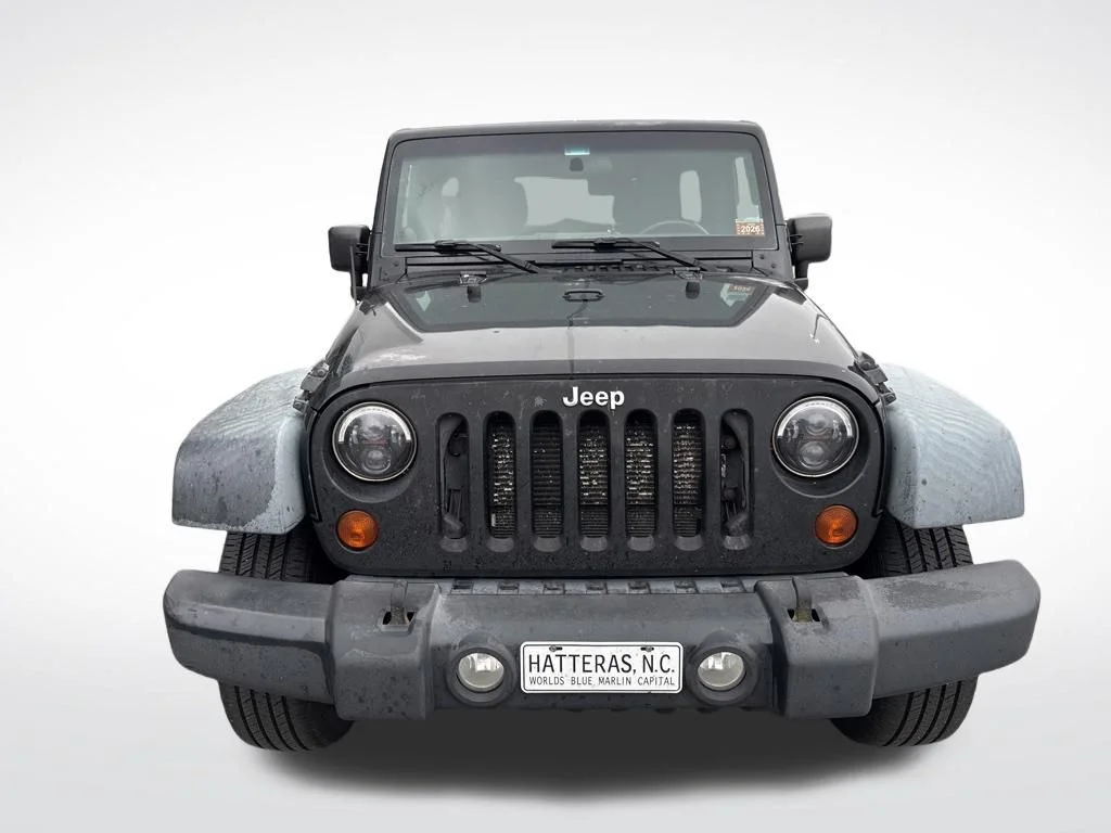 Used 2012 Black Jeep Unlimited Sport image 10