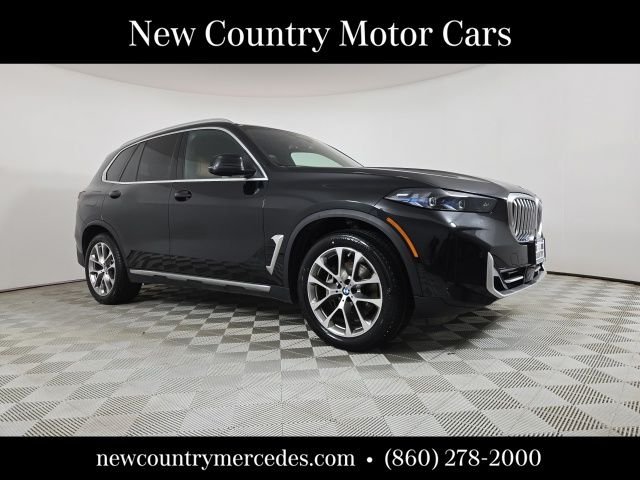 Used 2024 Black BMW xDrive40i image 1