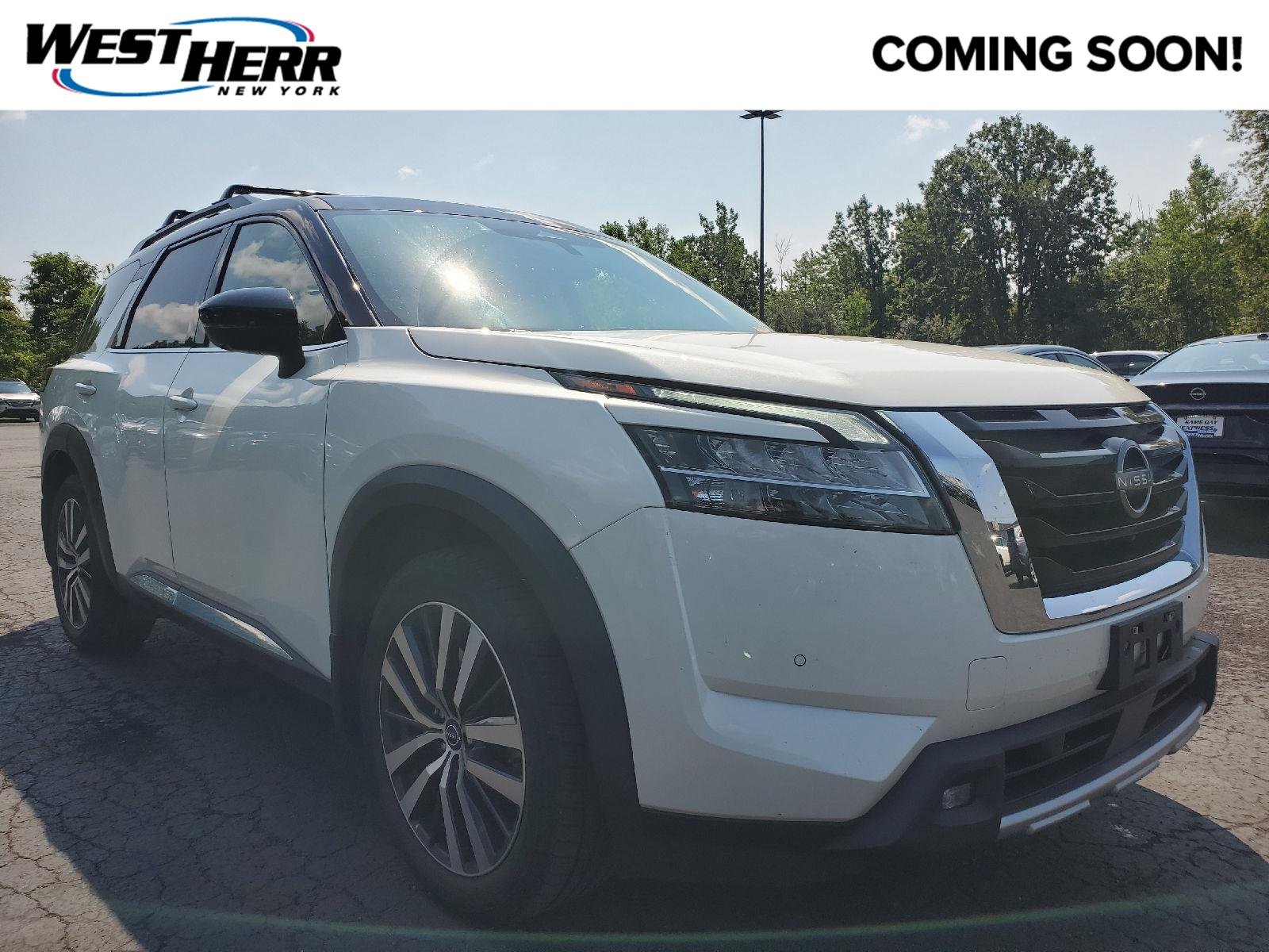 Used 2022 Pearl White Tricoat/Super Black Nissan Platinum image 1