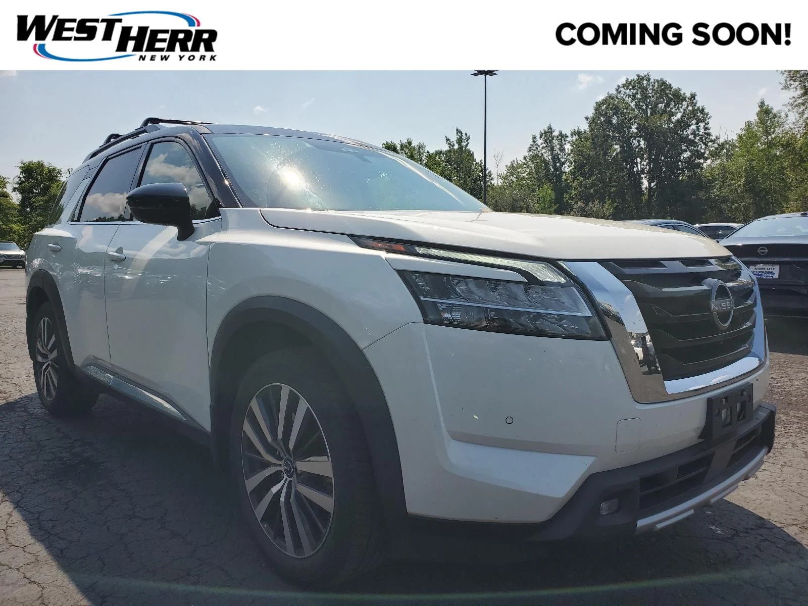 Used 2022 Pearl White Tricoat/Super Black Nissan Platinum image 1
