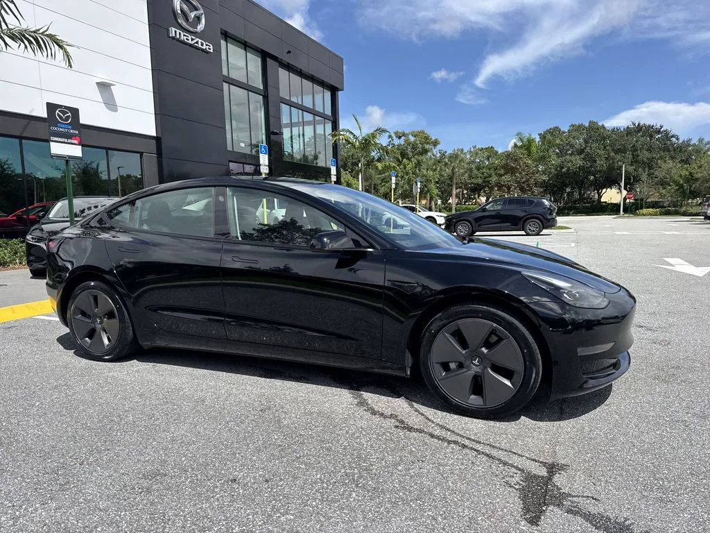 Used 2023 Solid Black Tesla  image 6