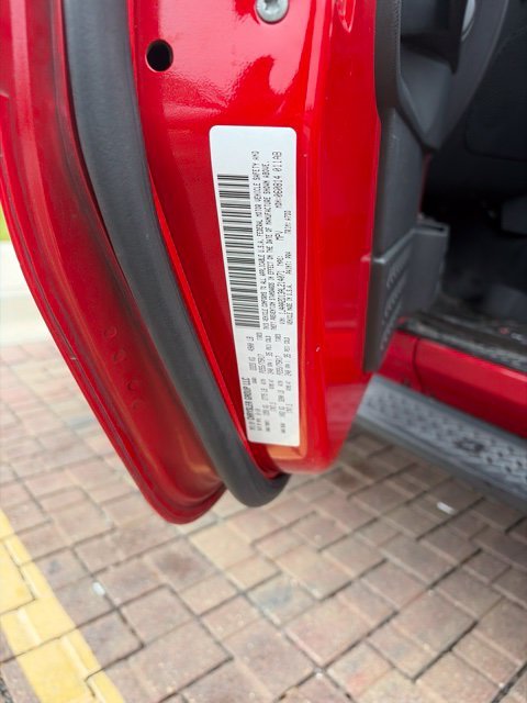 Used 2010 Red Jeep Sport image 1