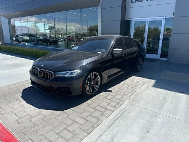 Used 2021 Black BMW M550i xDrive image 1