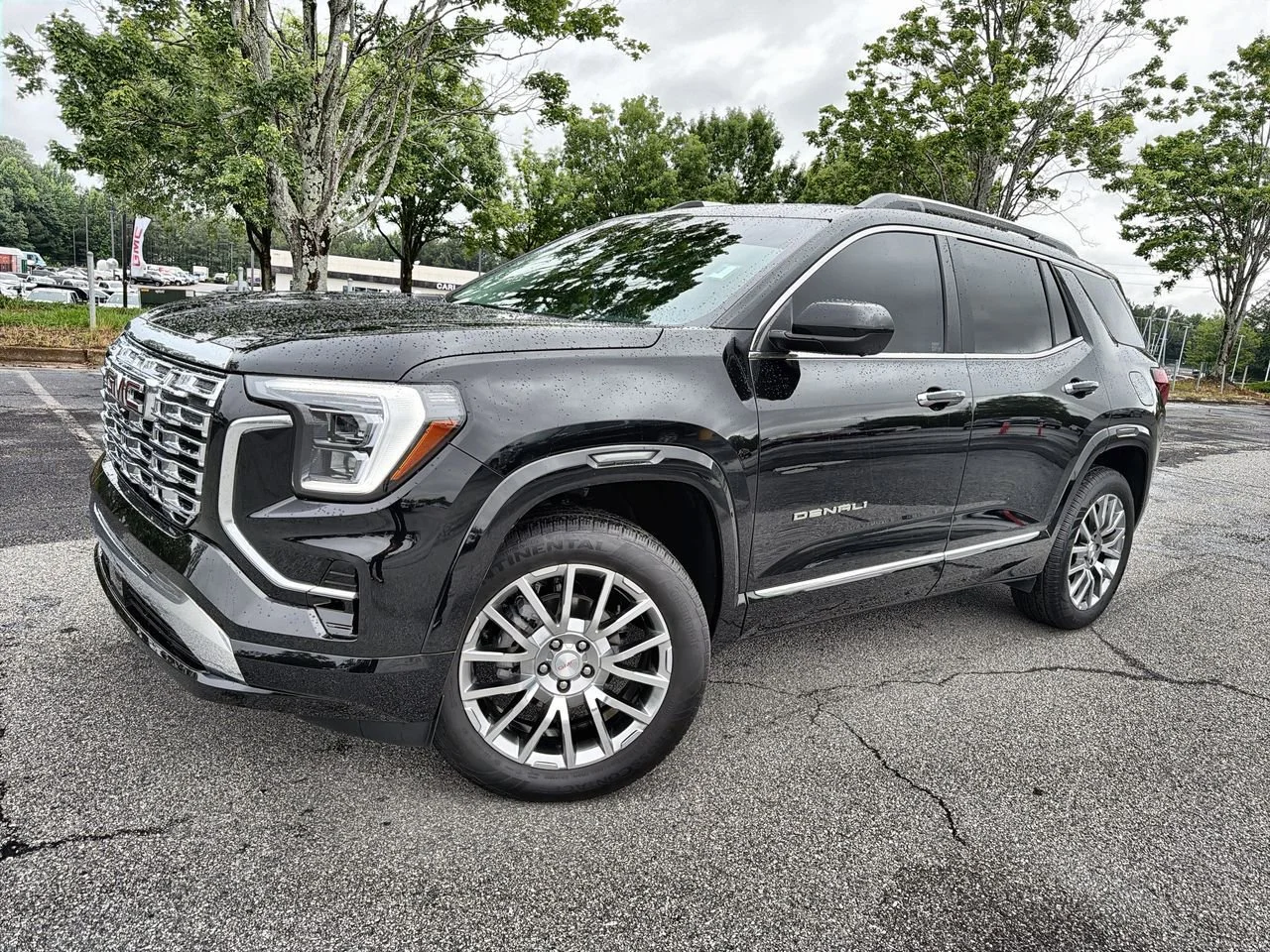 Used 2026 Ebony Twilight Metallic GMC Denali image 1
