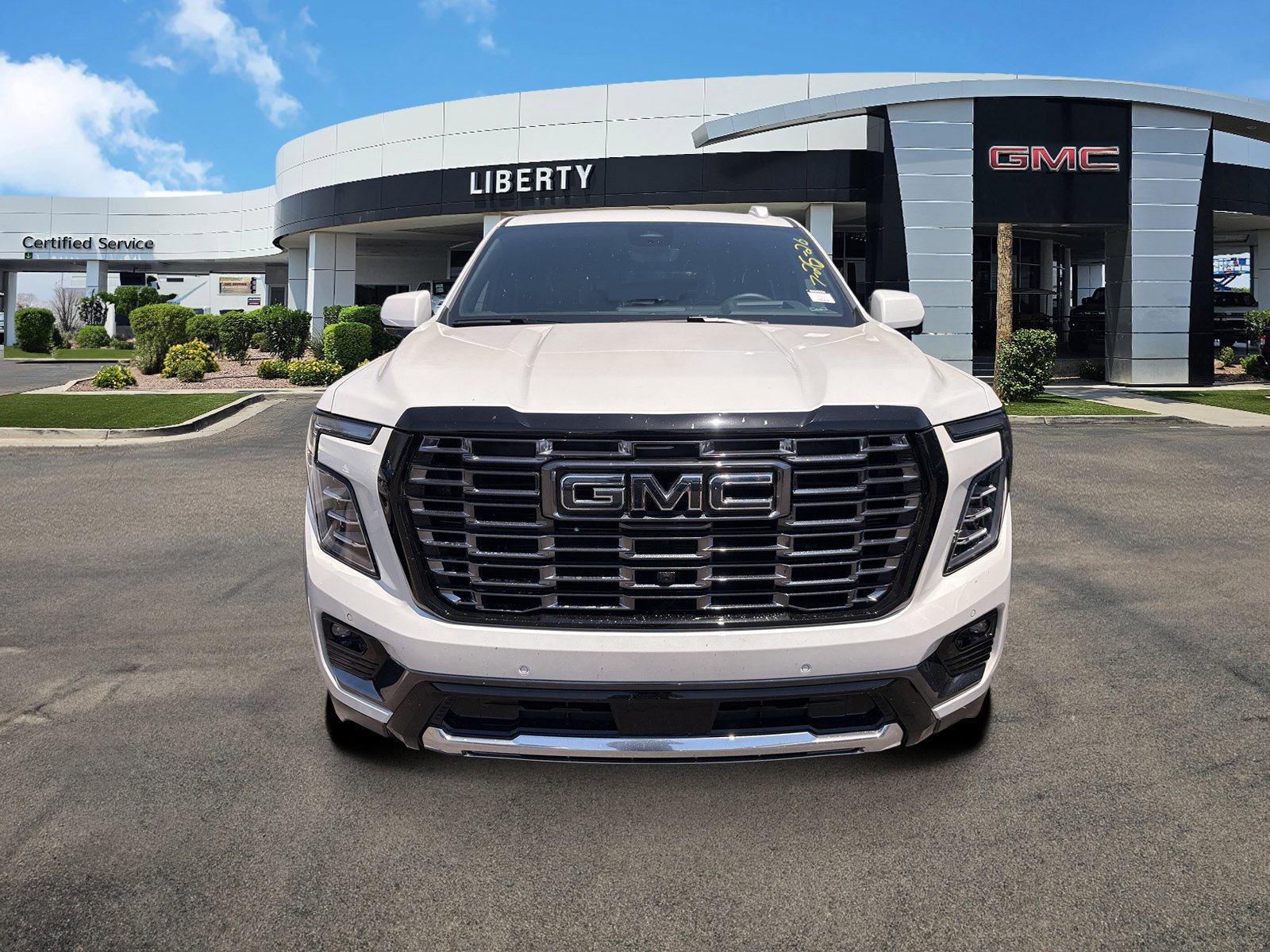 Used 2025 White Frost Tricoat GMC Denali Ultimate image 2