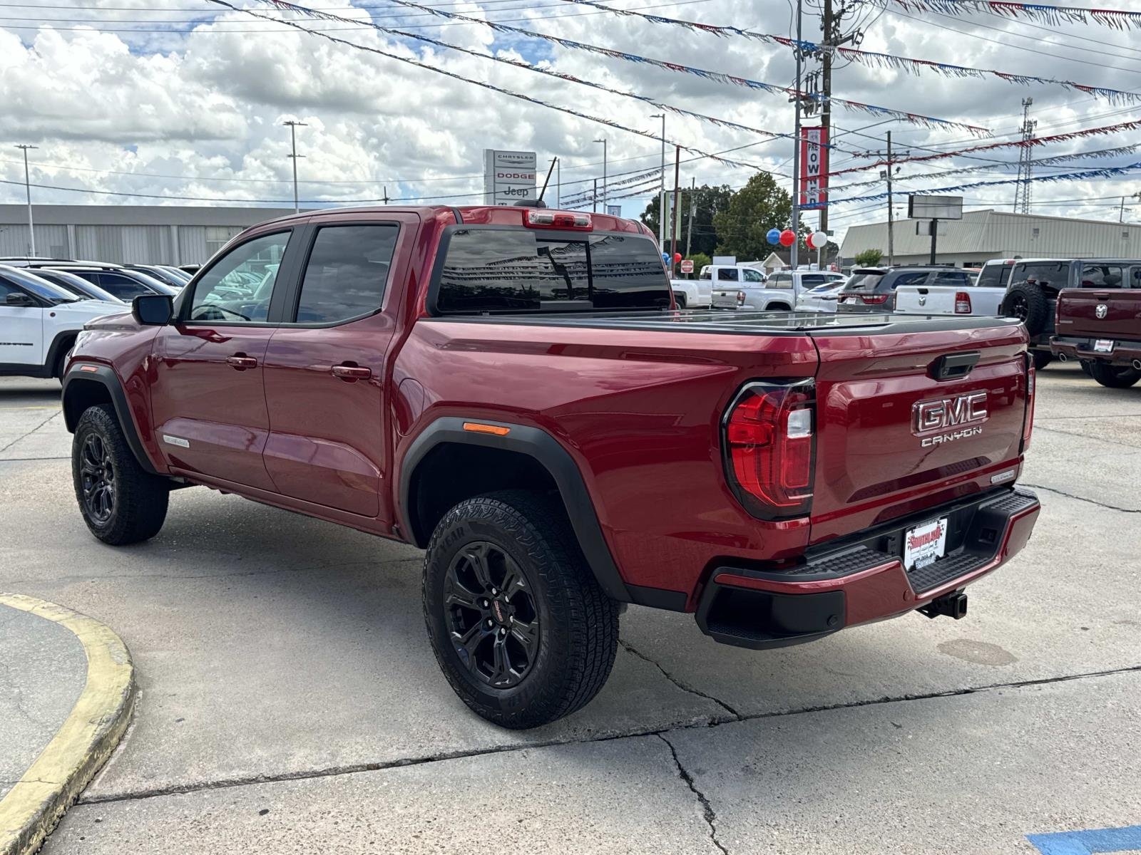 Used 2025 Volcanic Red Tintcoat GMC 2WD Elevation image 5