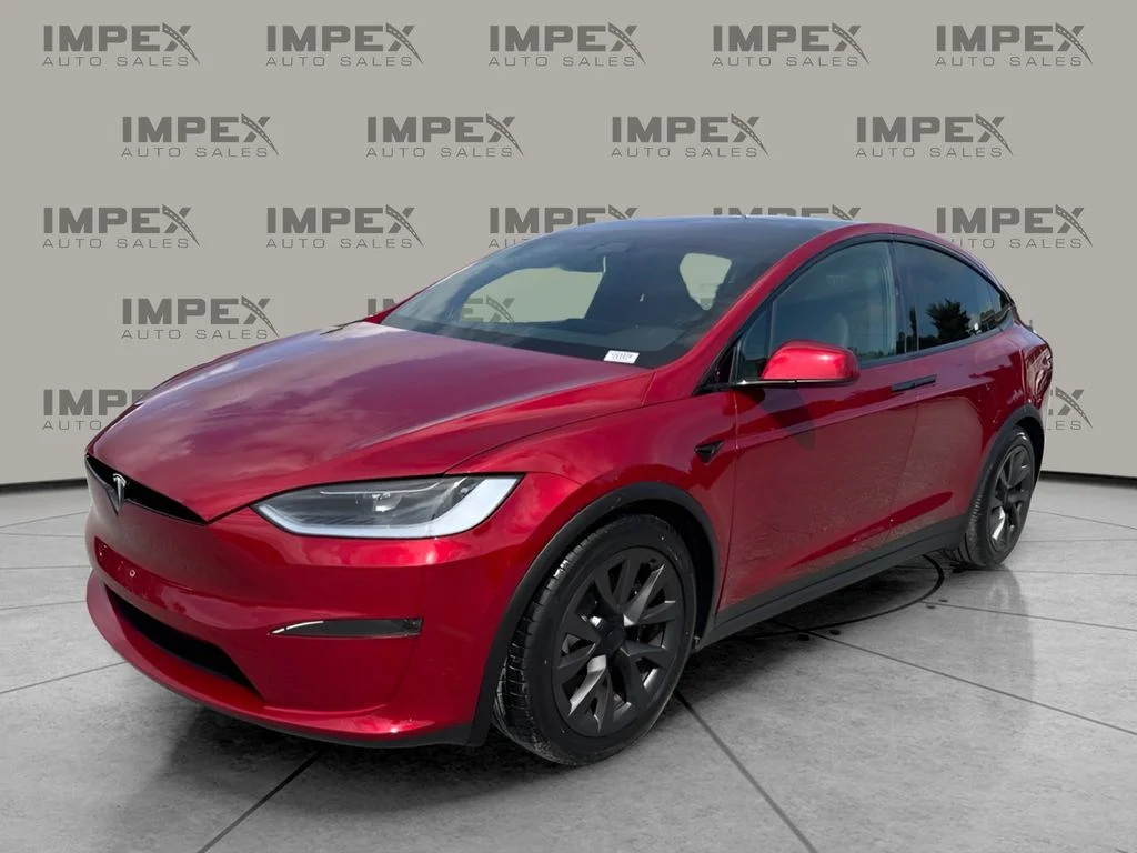 Used 2023 Red Tesla Base image 1