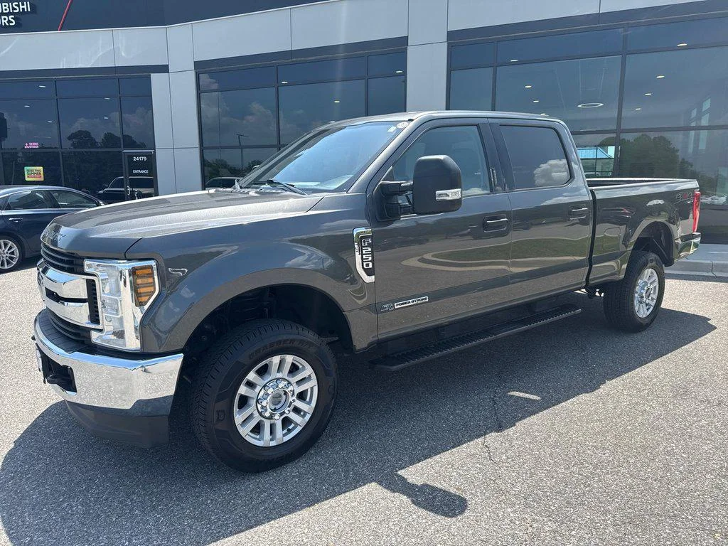 Used 2019 Magnetic Metallic Ford XLT 4WD Crew Cab 6.75 Box image 1