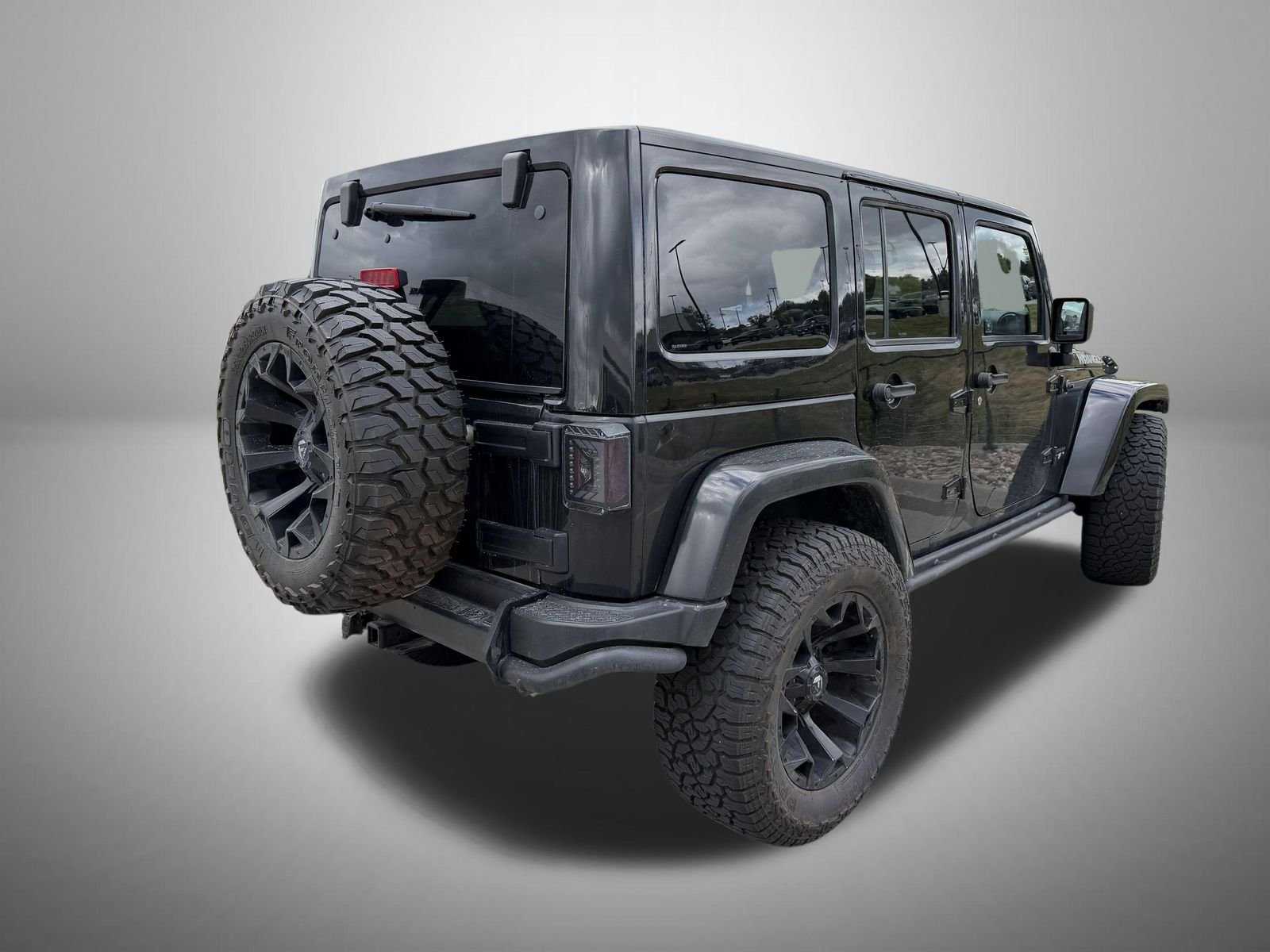 Used 2017 Black Jeep Unlimited Sahara image 4