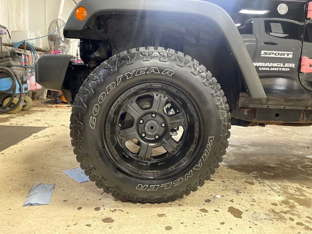 Used 2013 Black Jeep Unlimited Sport image 11