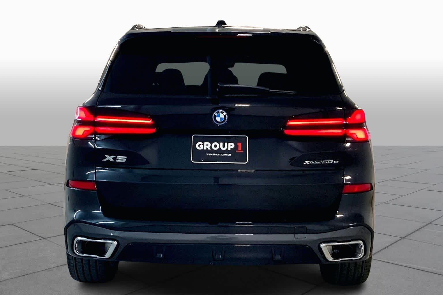 New 2026 Black Sapphire Metallic BMW xDrive50e image 4