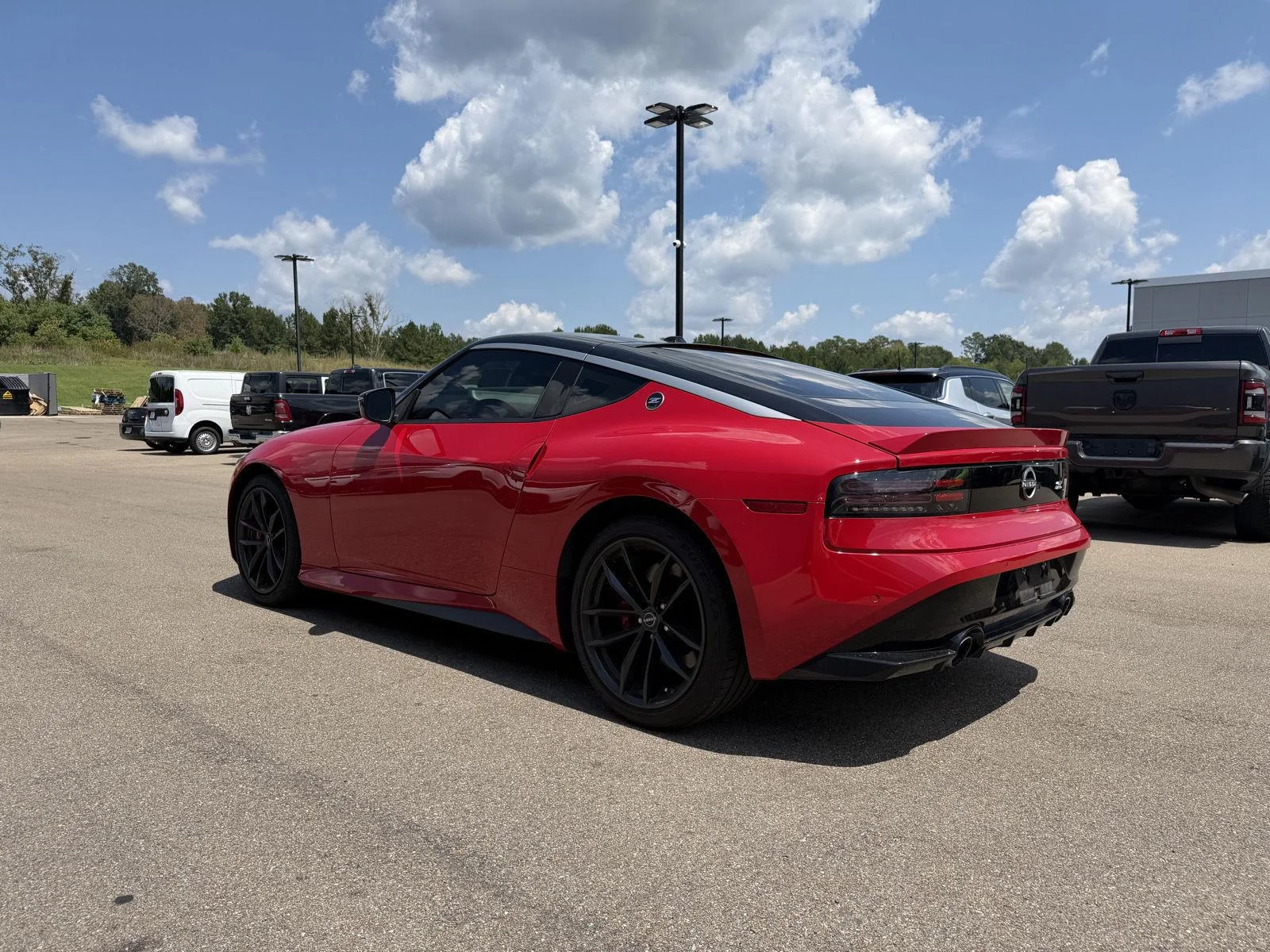 Used 2025 Solid Red/Super Black Nissan Performance image 4