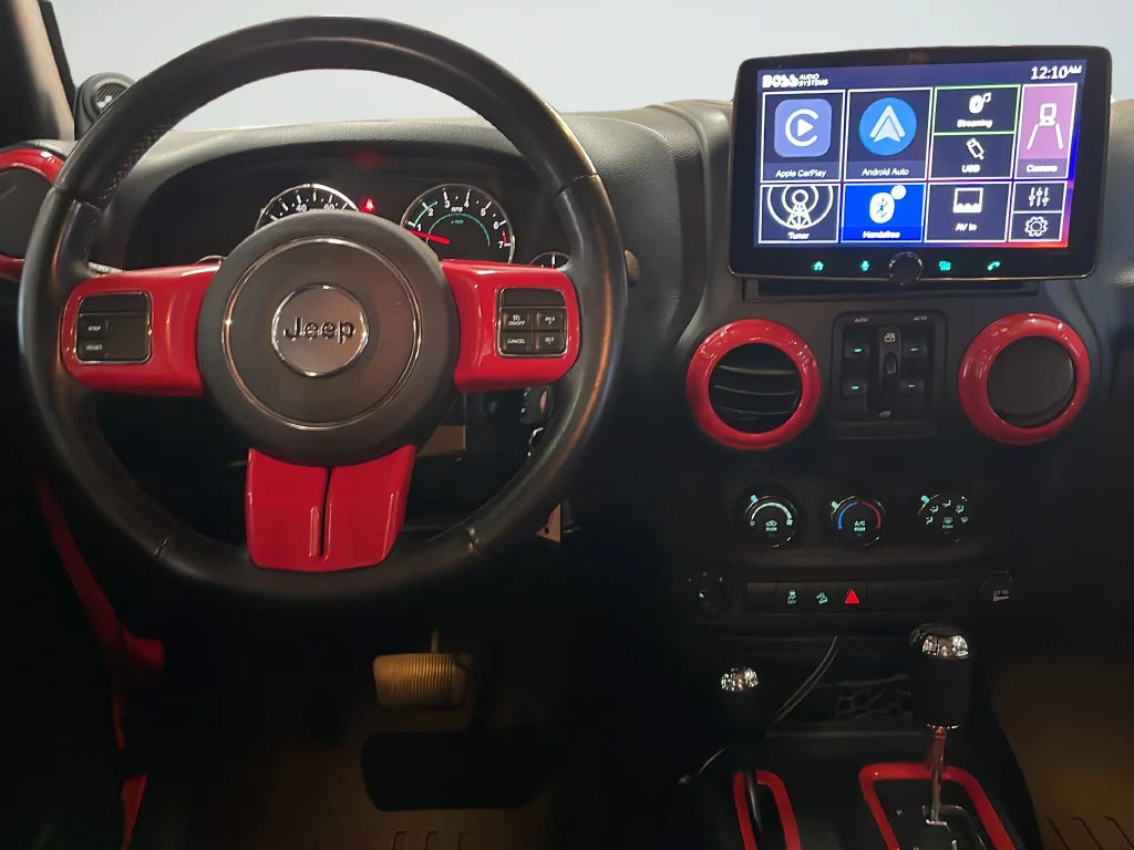 Used 2013 Red Jeep Unlimited Sport image 12
