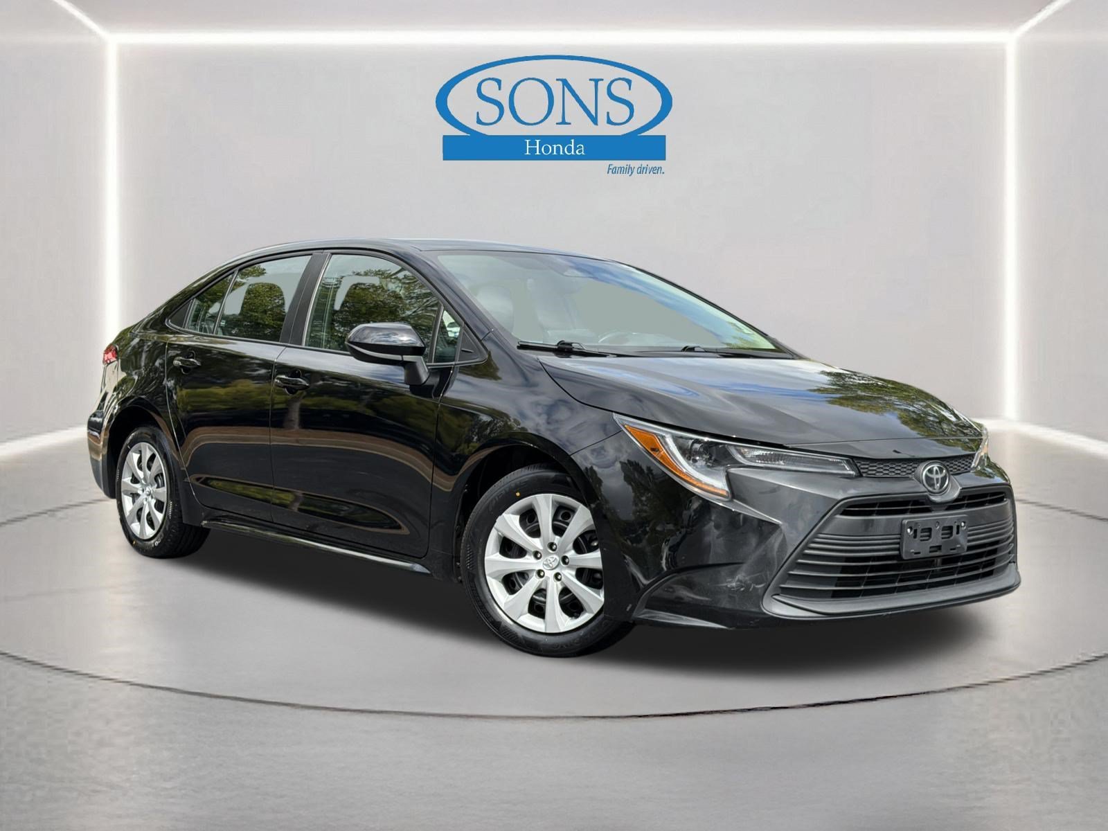 Used 2025 Midnight Black Metallic Toyota LE image 1