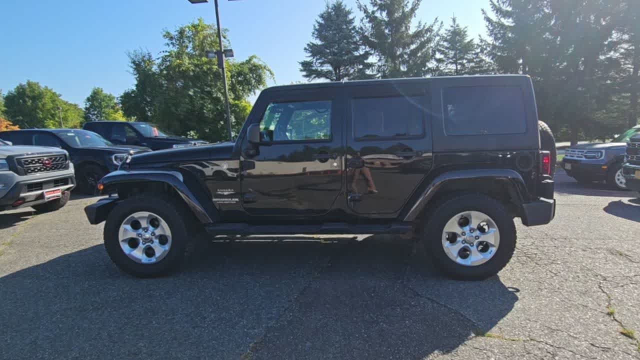 Used 2014 Black Clear Coat Jeep Sahara image 5